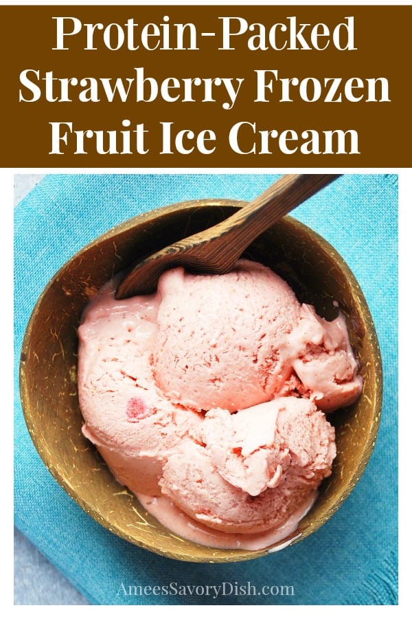 Overhead photo of strawberry frozen fruit ice cream in a coconut bowl with text description for Pinterest