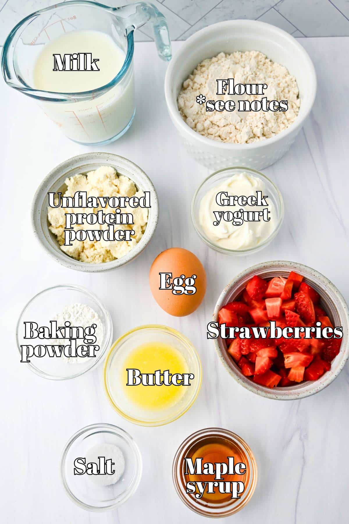 strawberry protein pancake ingredients measured out on a counter
