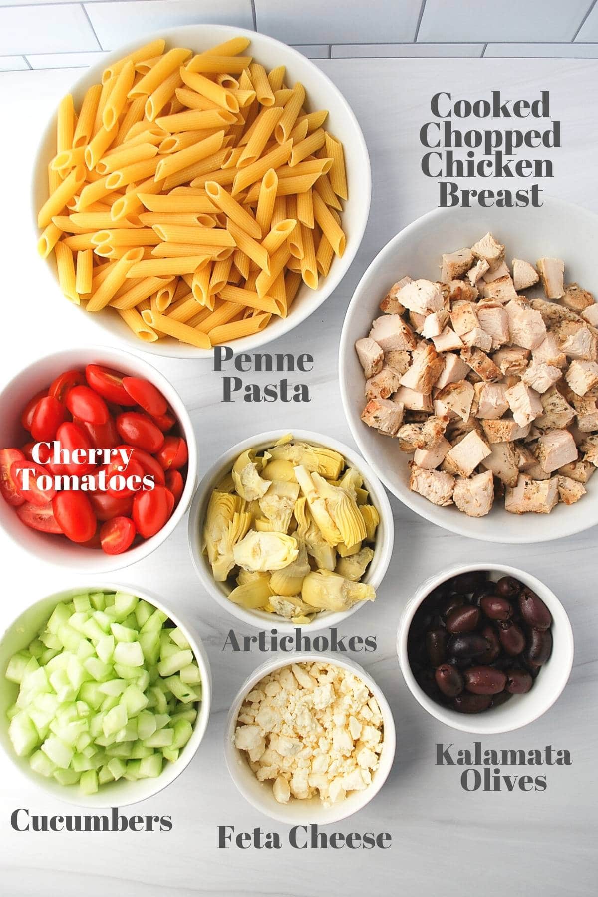 labeled ingredients for greek chicken pasta salad