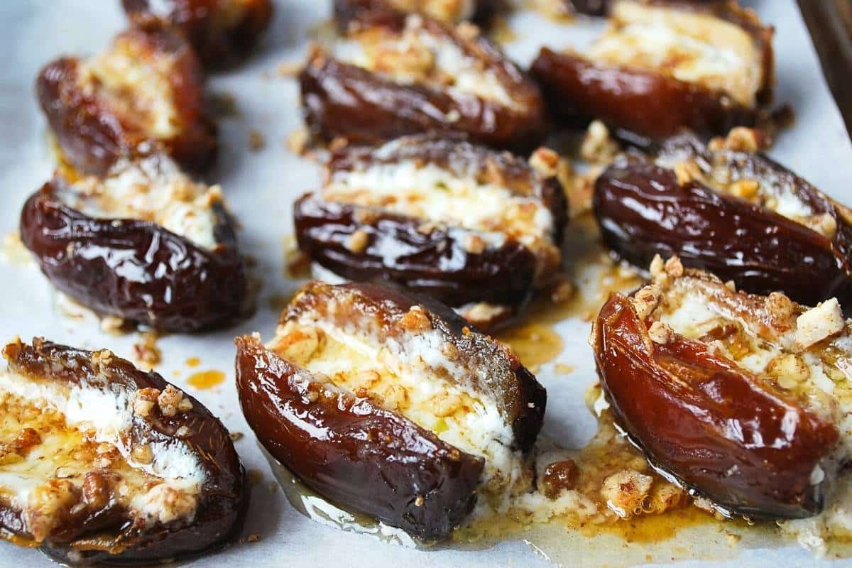 stuffed dates fresh out of the oven on a baking sheet