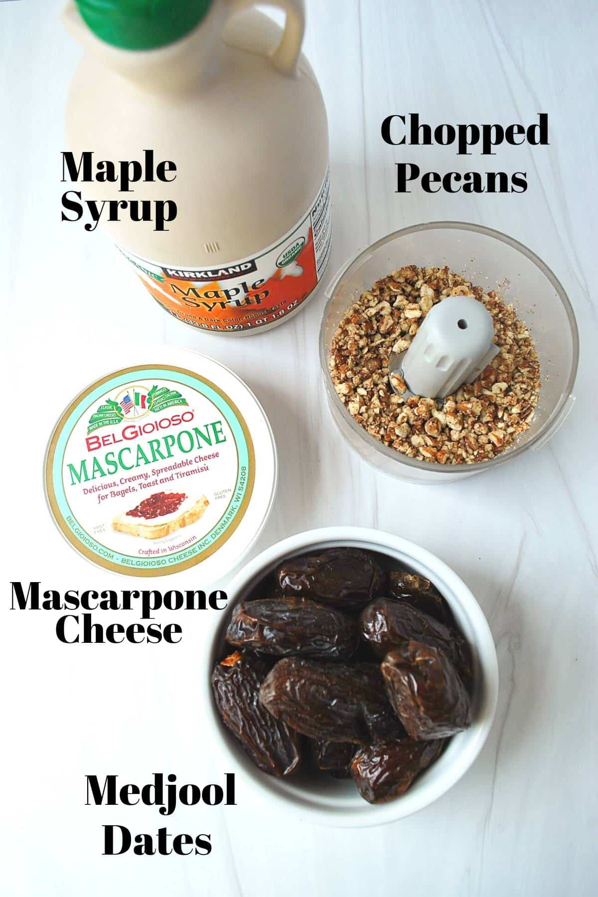 maple syrup, dates, mascarpone cheese and chopped pecans on a counter