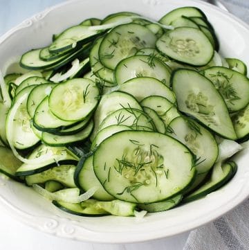 close up of a bowl of old-fashioned cucumber salad with fresh dill