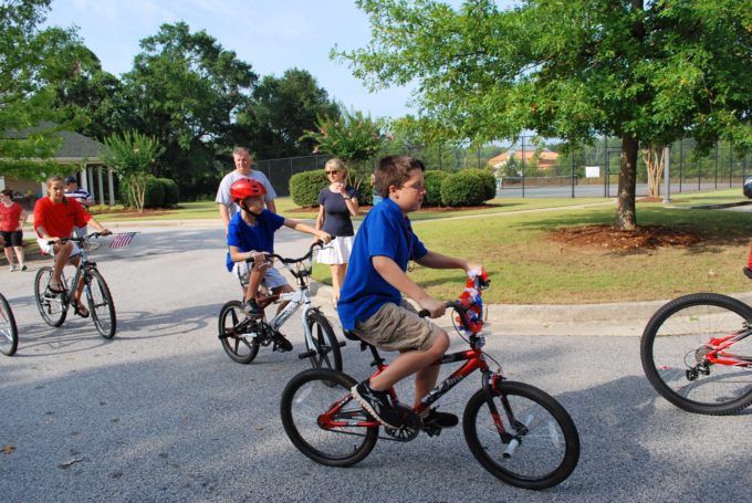 A group of people riding bicycles