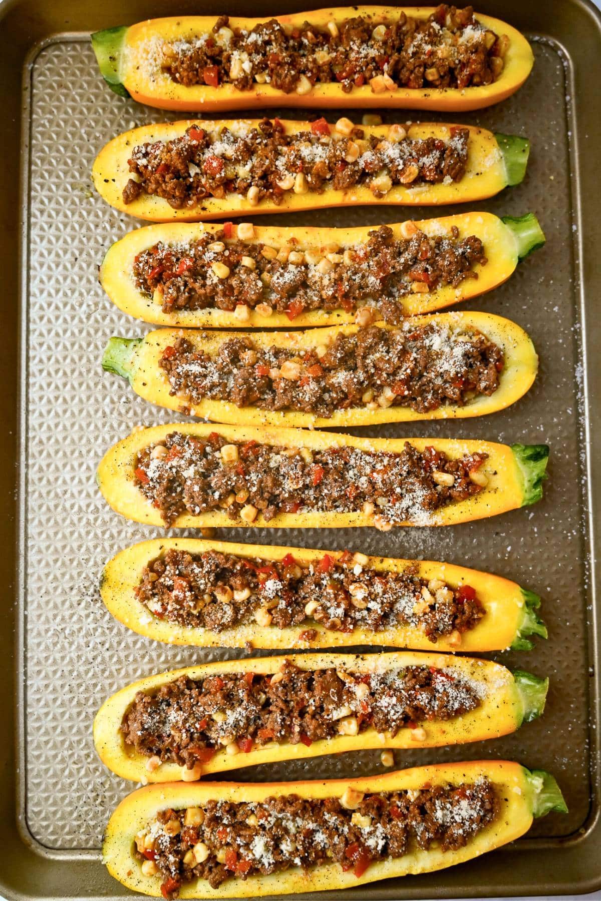 stuffed yellow squash with ground beef, peppers, corn and spices