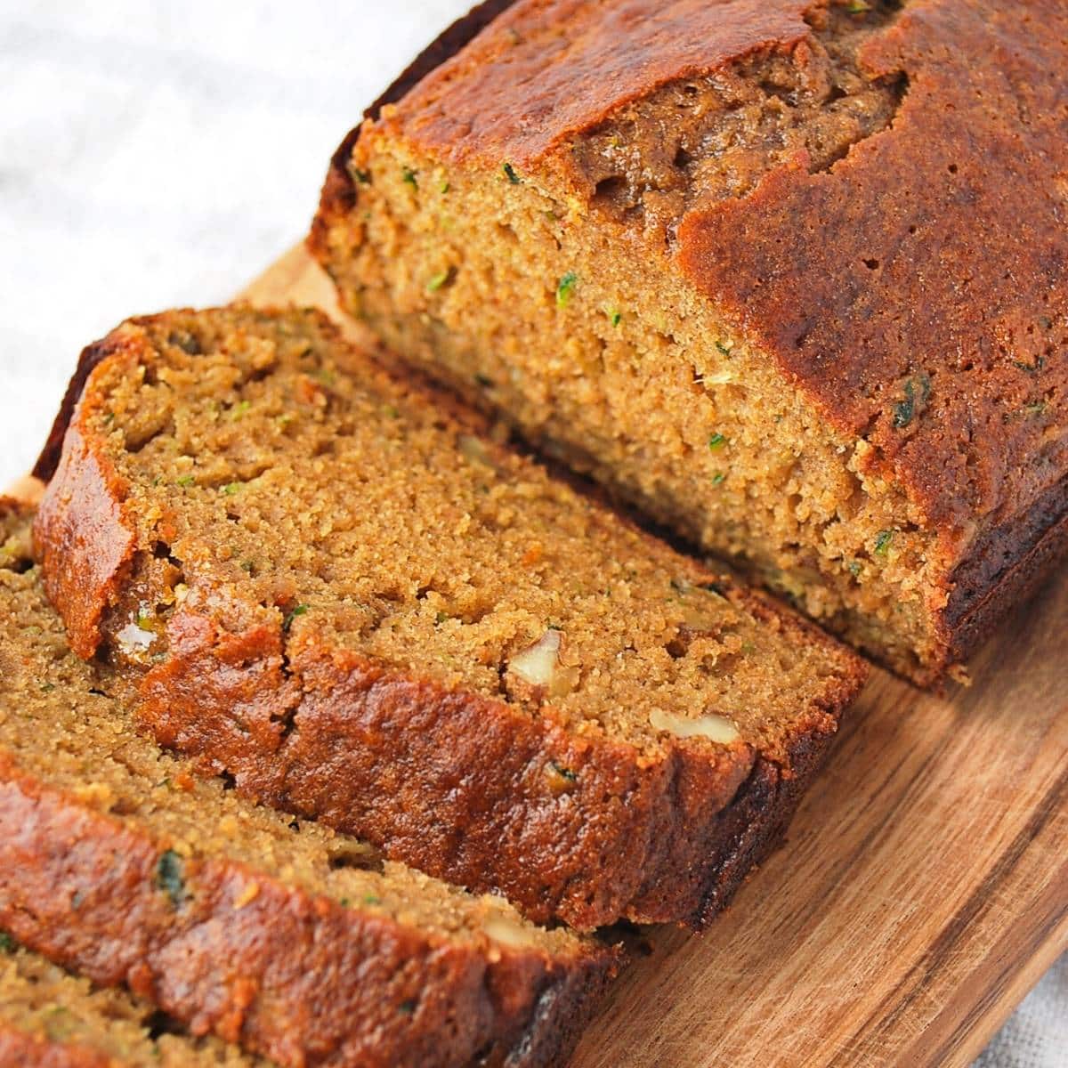 close up of a half sliced loaf of zucchini bread