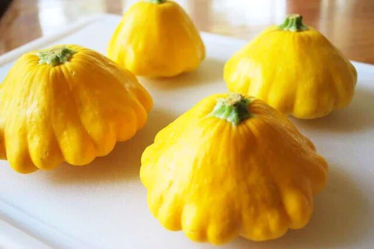 4 patty pan squash on a cutting board