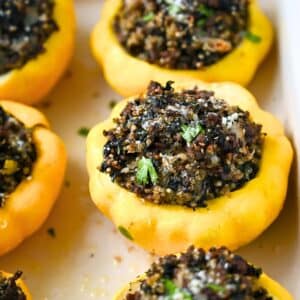 close up of stuffed patty pan squash with ground beef baked and topped with fresh parsley