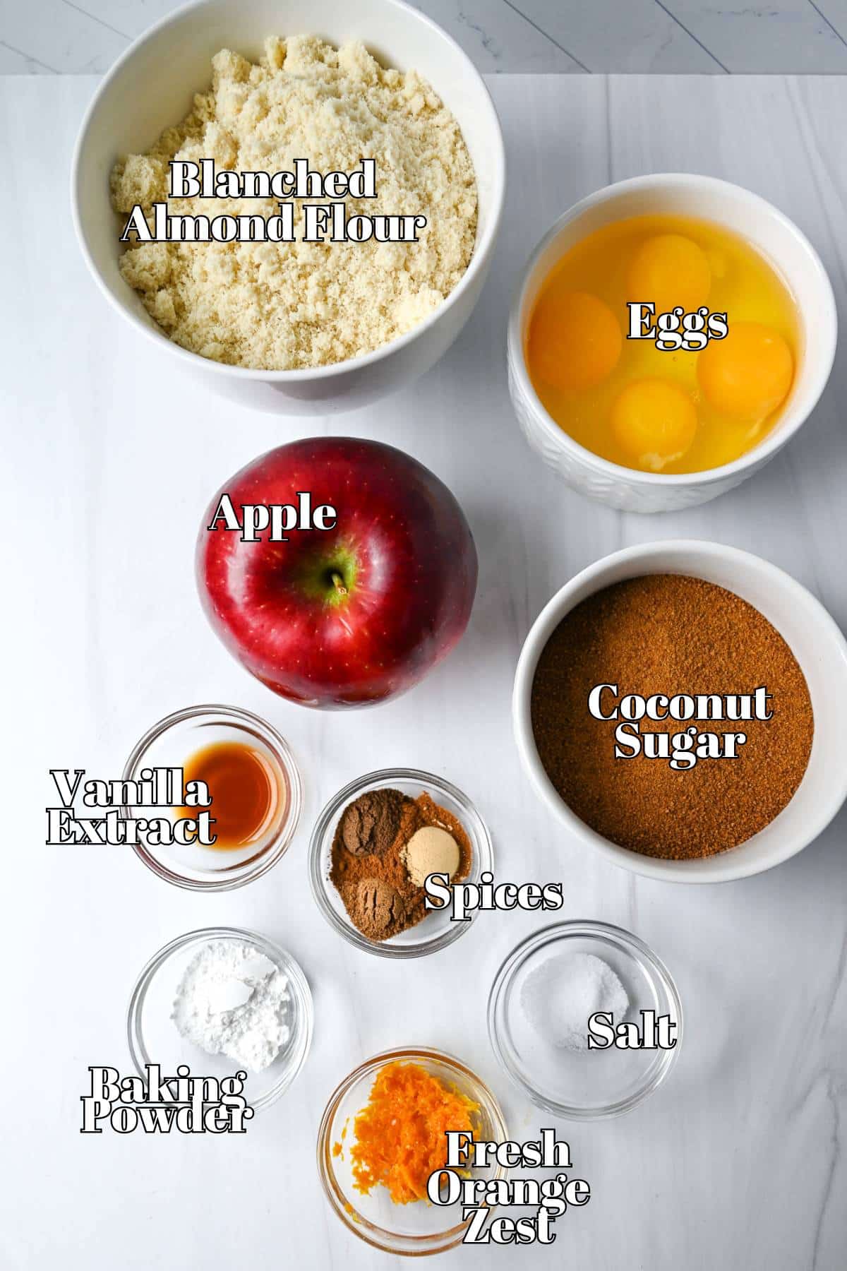 ingredients to make a grain free gluten free spice cake with apples measured out on a counter