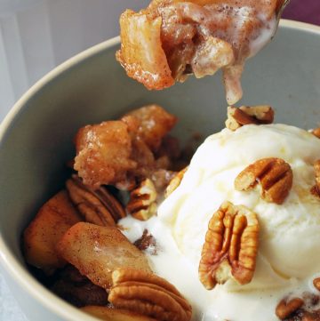 spoonful of baked apples with ice cream