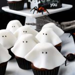 floating ghost cupcakes for Halloween on a tray