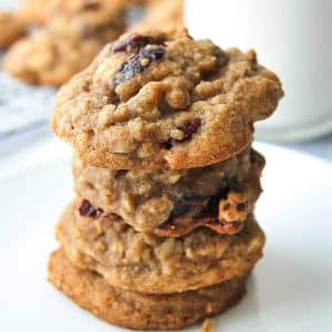 stack of gluten free oatmeal cranberry cookies with a glass of milk