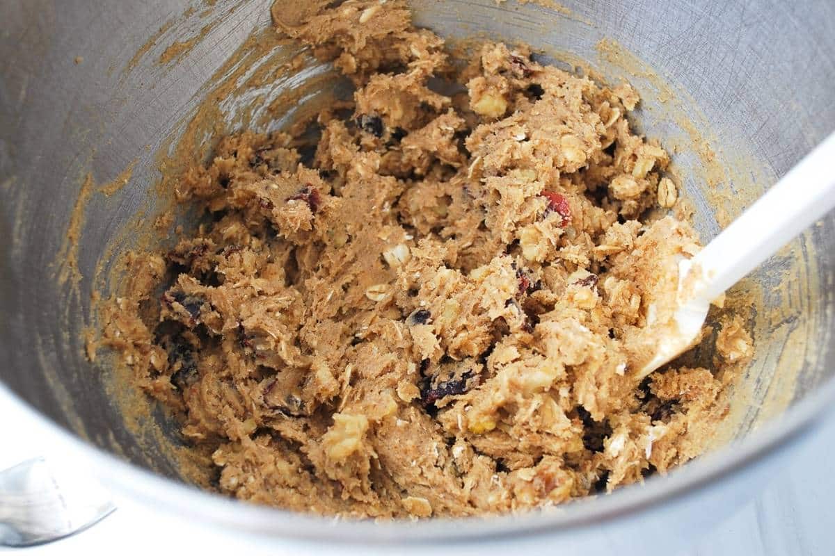 cookie dough mixed in a stainless steel bowl with a spoon