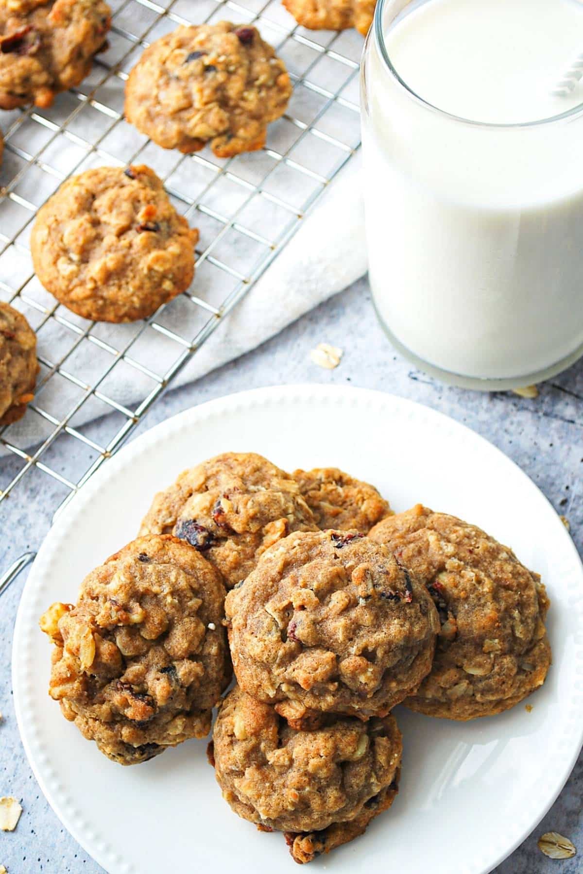 a plate of gluten free oatmeal cookies with milk