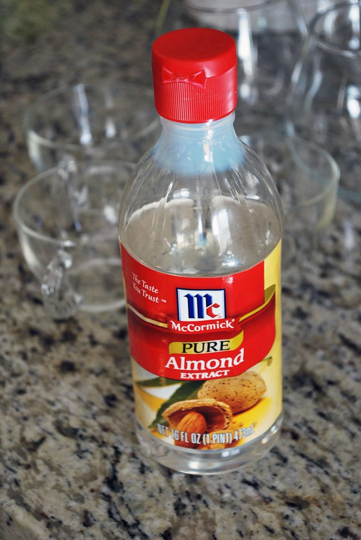 almond extract for punch with glasses in background