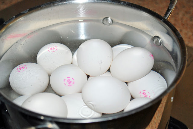 uncooked eggs, ready to be hard-boiled