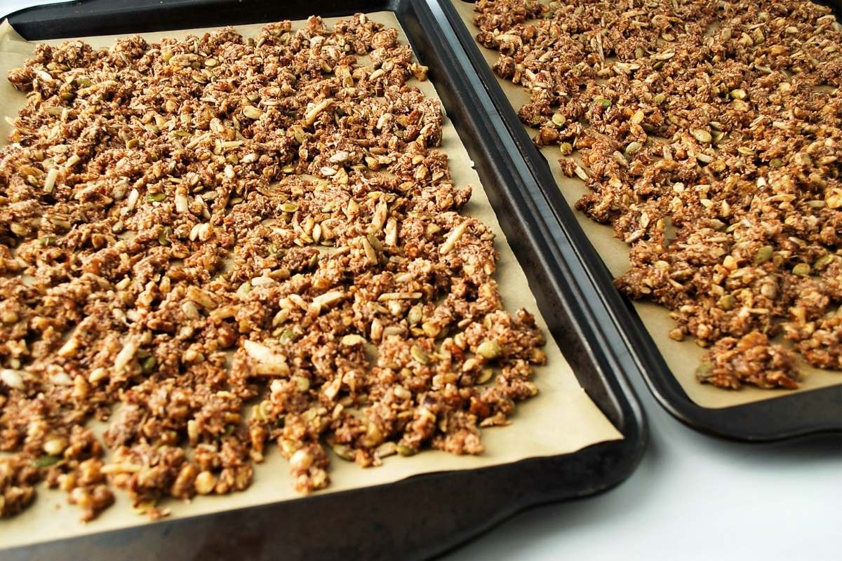 low carb granola spread on sheet pans to bake
