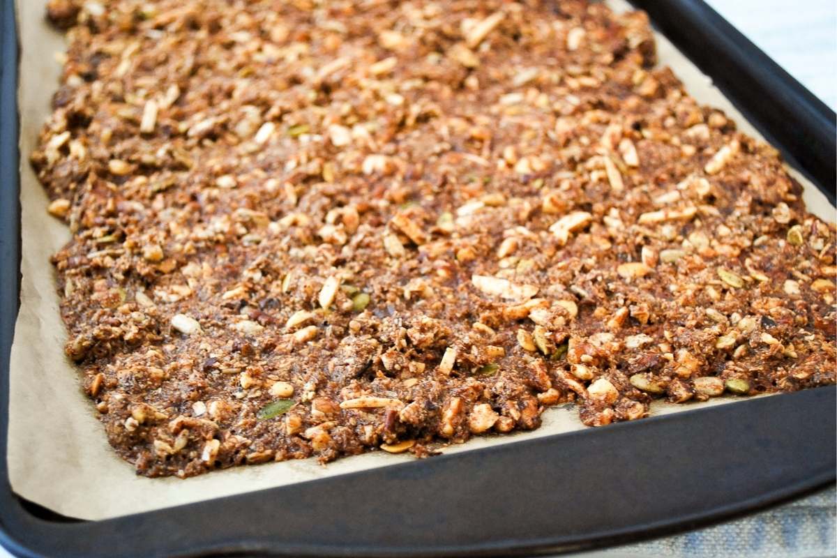 freshly baked low carb granola on a baking sheet