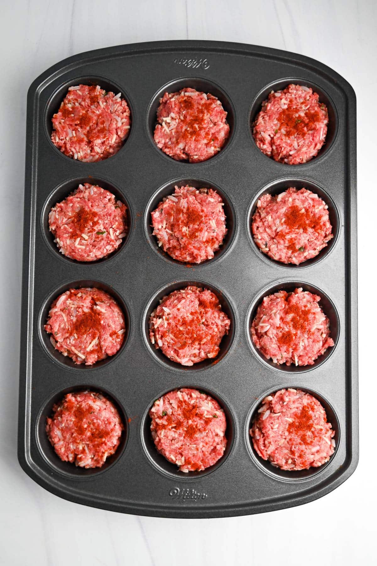 mini meatloaves in a muffin tin