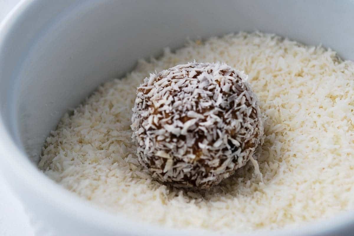 date ball being rolled in coconut
