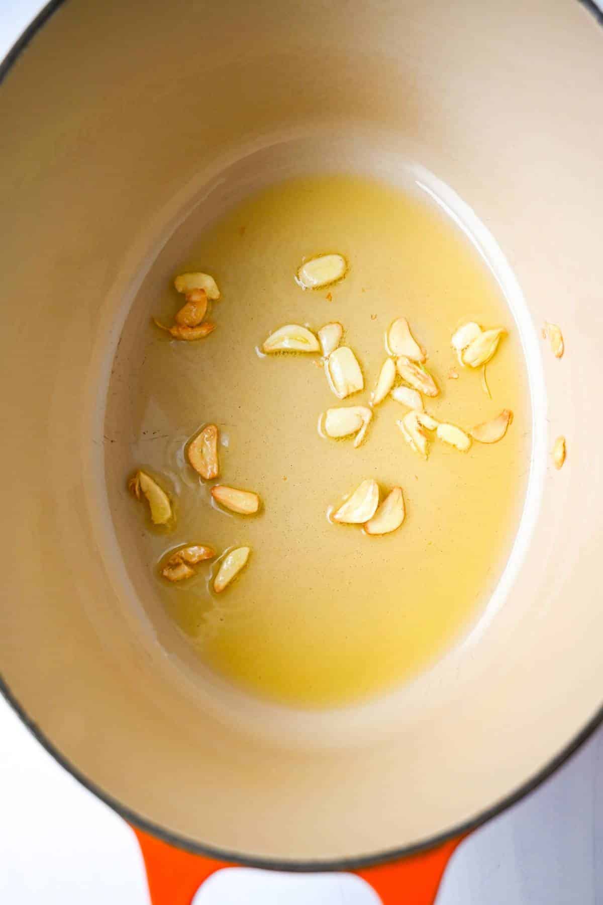 bloomed garlic in olive oil in a dutch oven