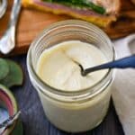 looking down into a jar of mayo with a spoon
