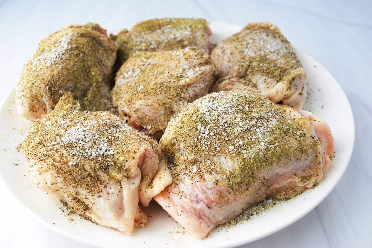 chicken thighs seasoned with greek seasoning, salt and pepper