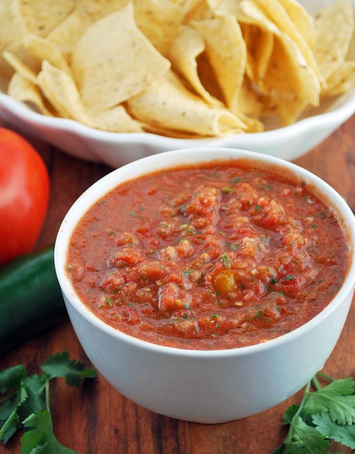 close up of bowl of fresh salsa with chips