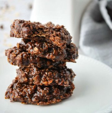 close up of stacked no-bake cookies with a napkin in the background