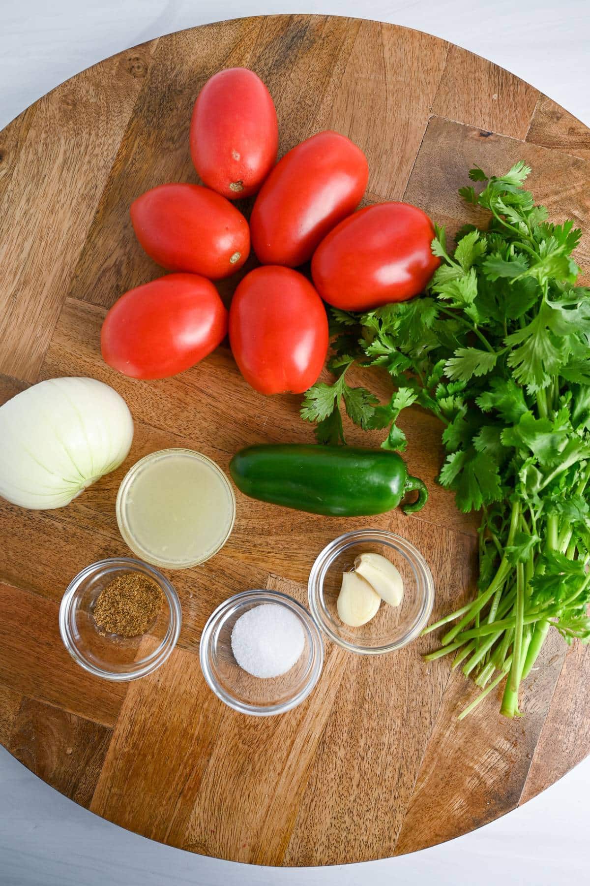 ingredients for blender salsa on a cutting board