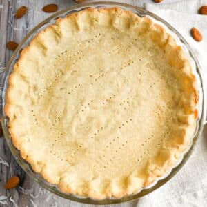 a baked almond flour pie crust with a napkin