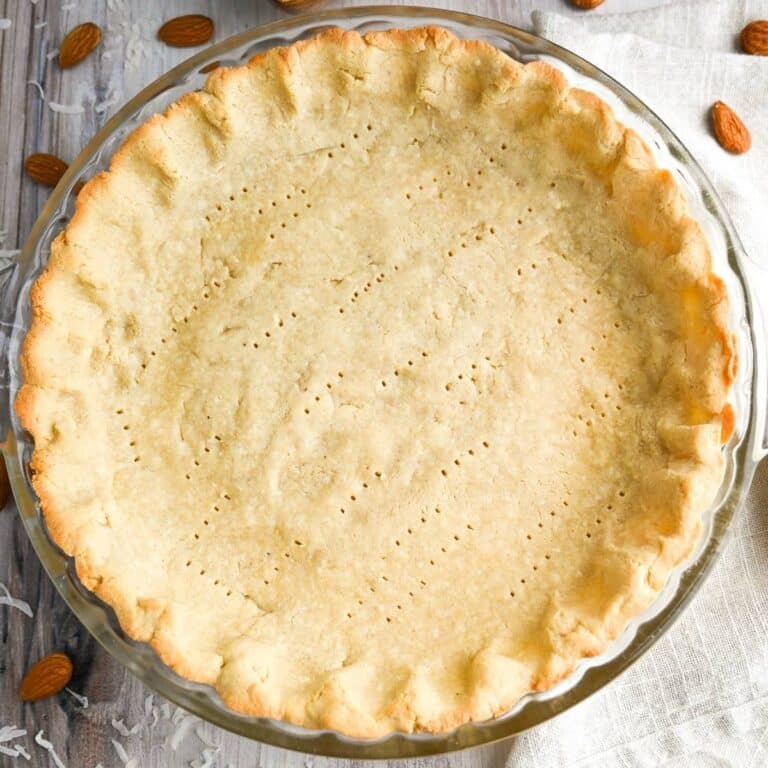 a baked almond flour pie crust with a napkin