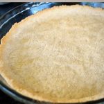 baked pie crust in a glass dish