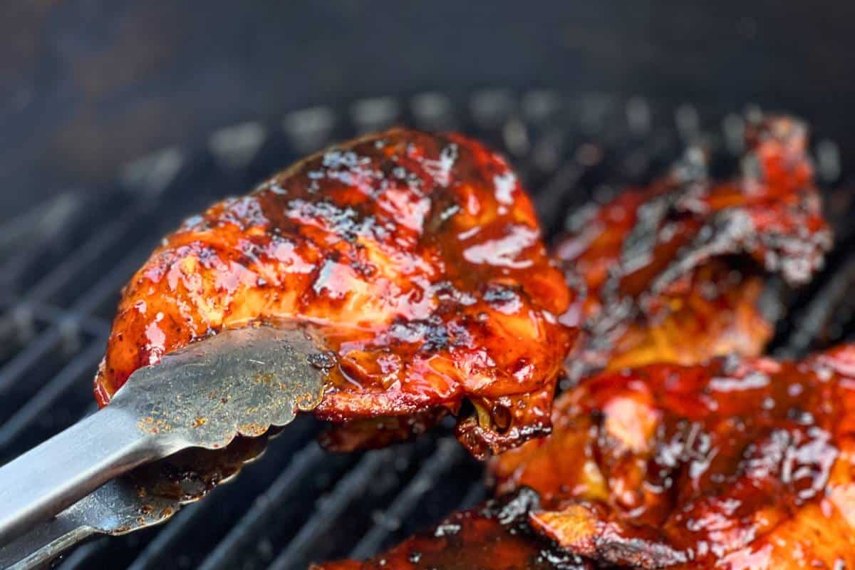 bbq basted chicken breast on the grill
