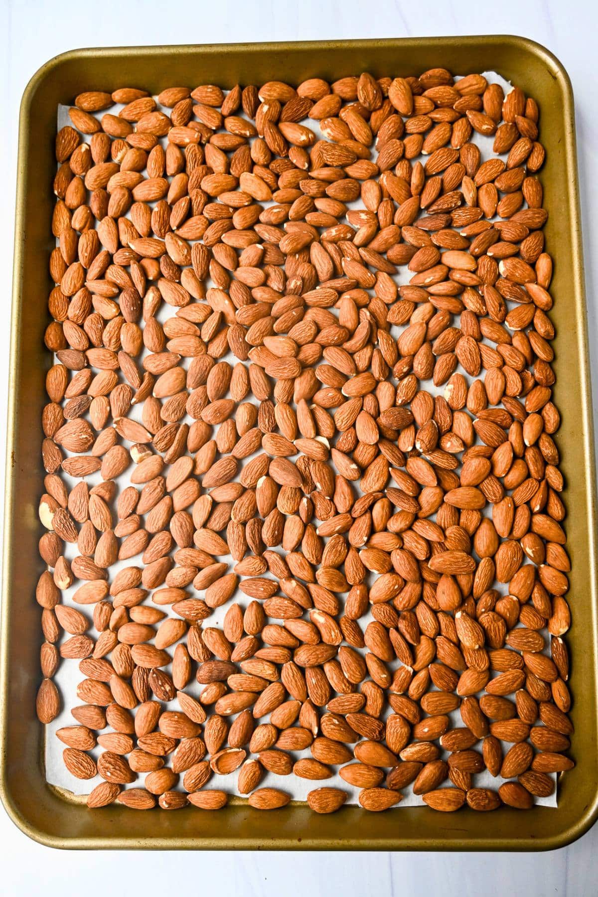 toasted almonds on a baking sheet