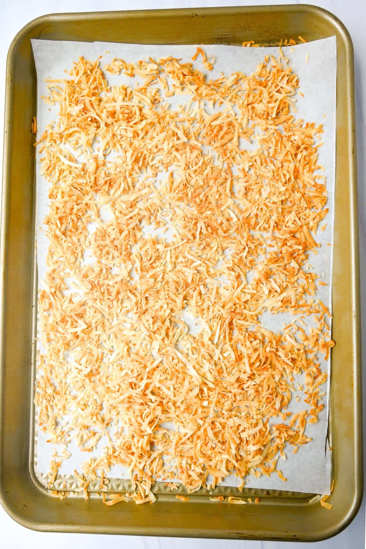 toasted coconut on a baking sheet