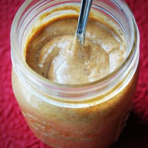 almond butter in a mason jar with a spoon