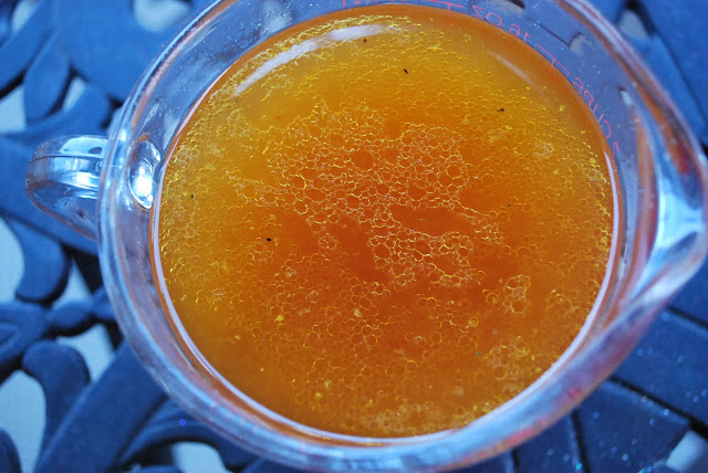 A close up of a bowl of chicken broth