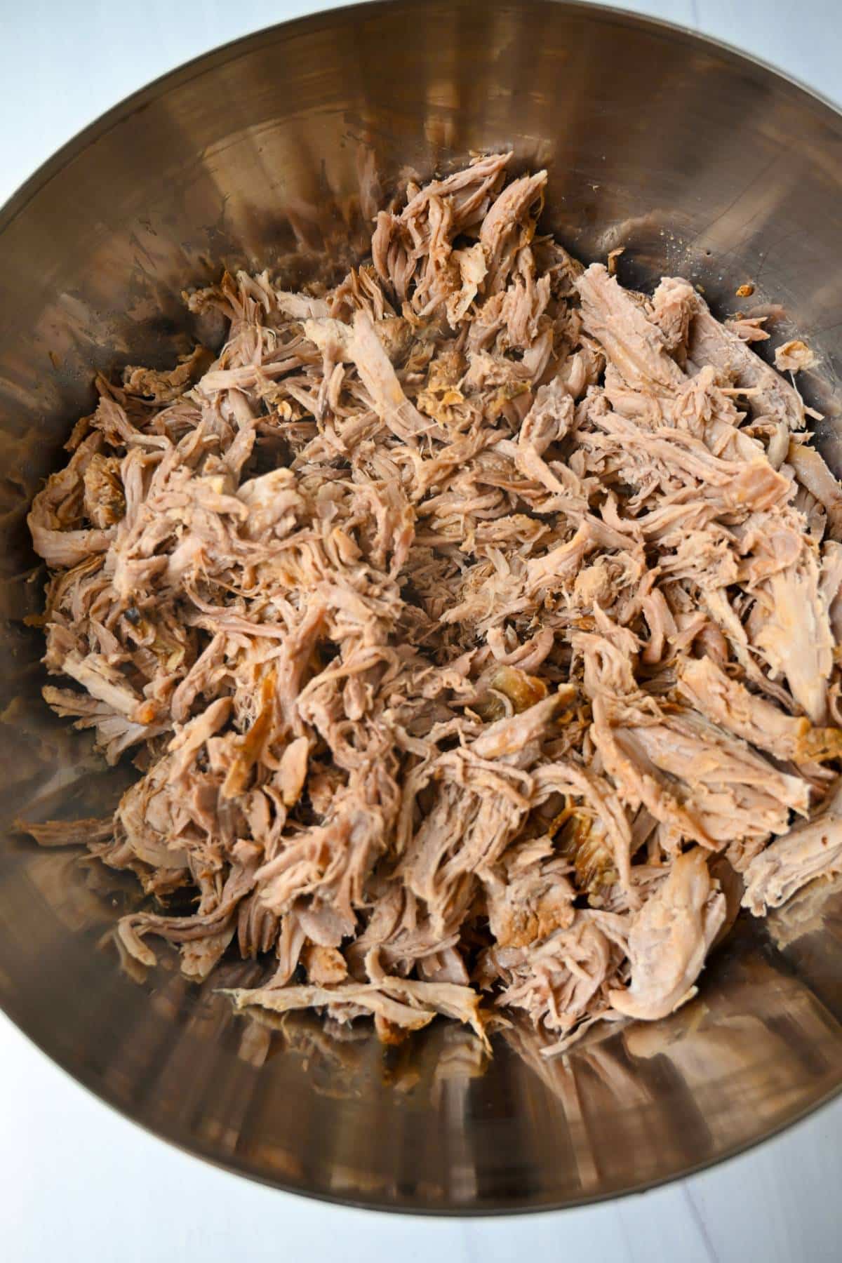 shredded boston butt pork roast in a bowl