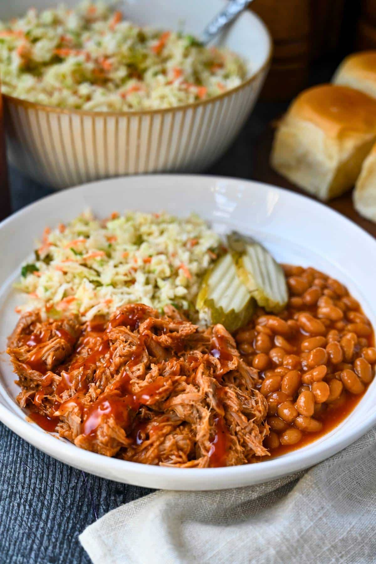 This Crockpot BBQ Pulled Pork recipe is incredibly easy, full of smoky, tangy flavor, and fall-apart tender. Perfect when you’re craving Southern-style pork BBQ on busy days! via @Ameessavorydish