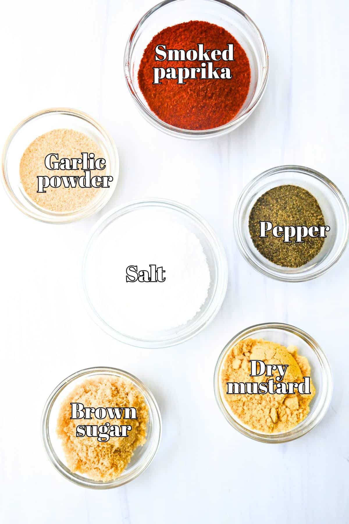 dry rub bbq ingredients measured out and labeled