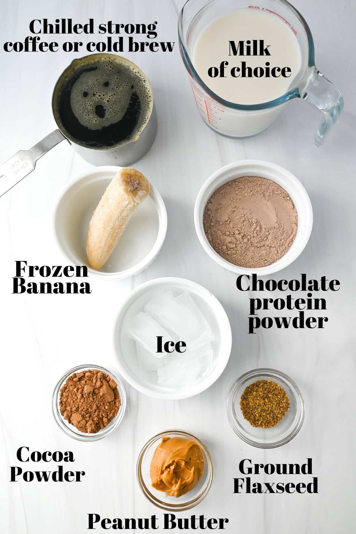 ingredients for a mocha protein shake measured out on a counter
