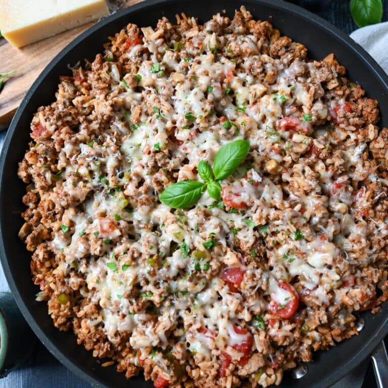 a one-dish skillet with ground beef and Italian pork sausage, rice, tomtatoes, cheese and herbs