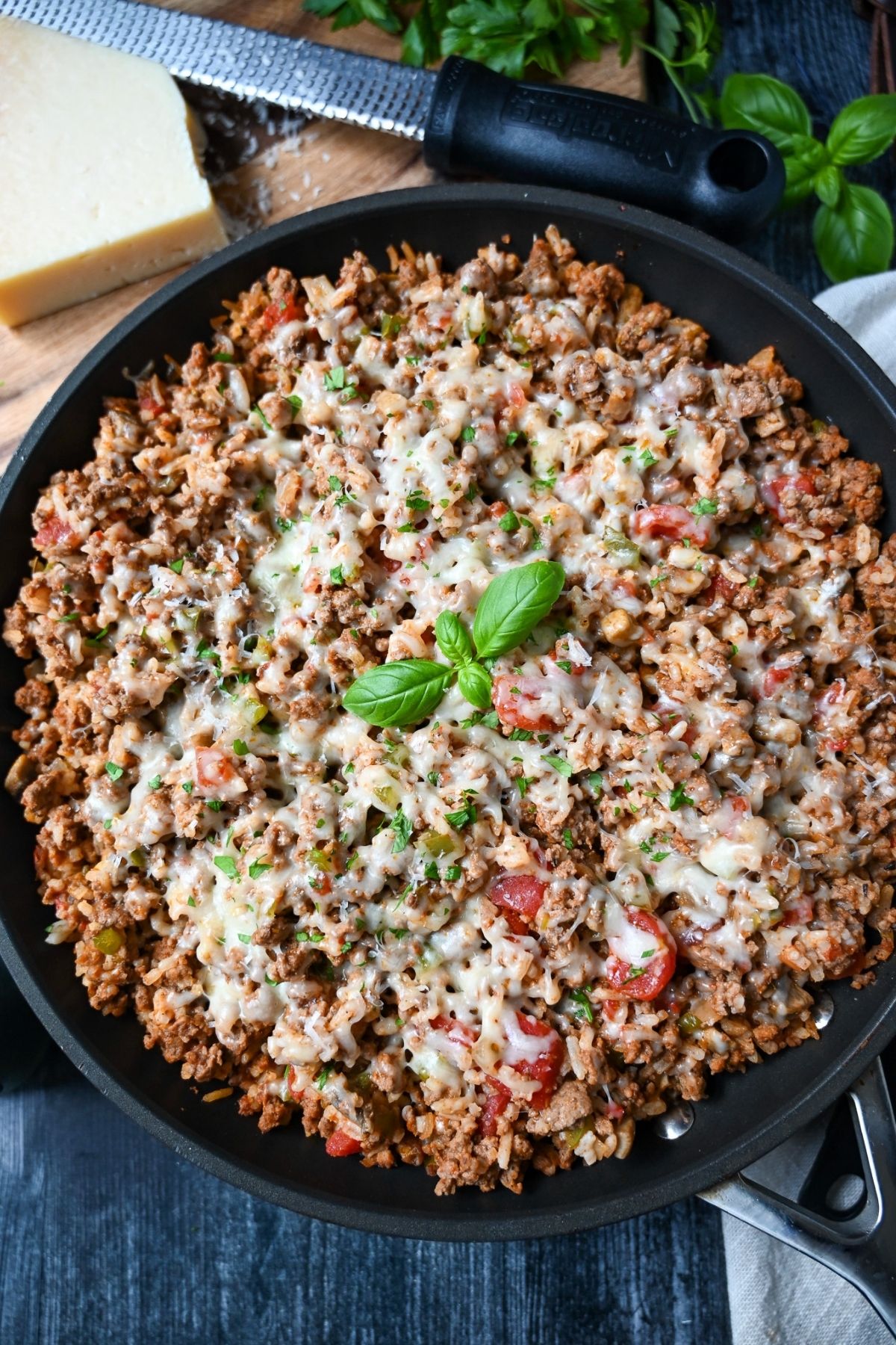 This high-protein Italian Ground Beef Skillet Recipe features lean ground beef, Italian sausage, fresh veggies, and rice, simmered in a flavorful tomato sauce. Ready in 30 minutes! via @Ameessavorydish