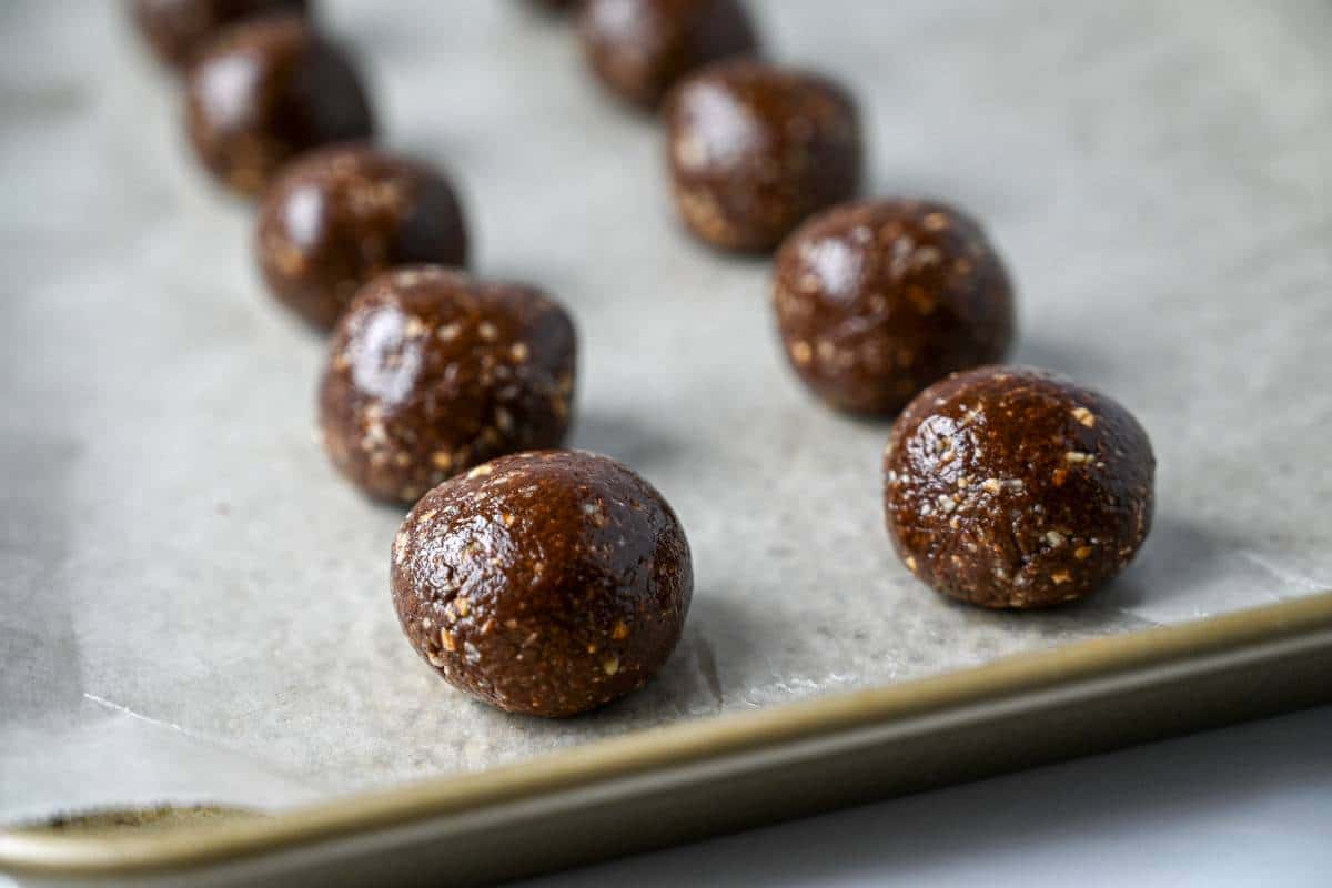 nutella balls on a lined baking sheet ready to chill