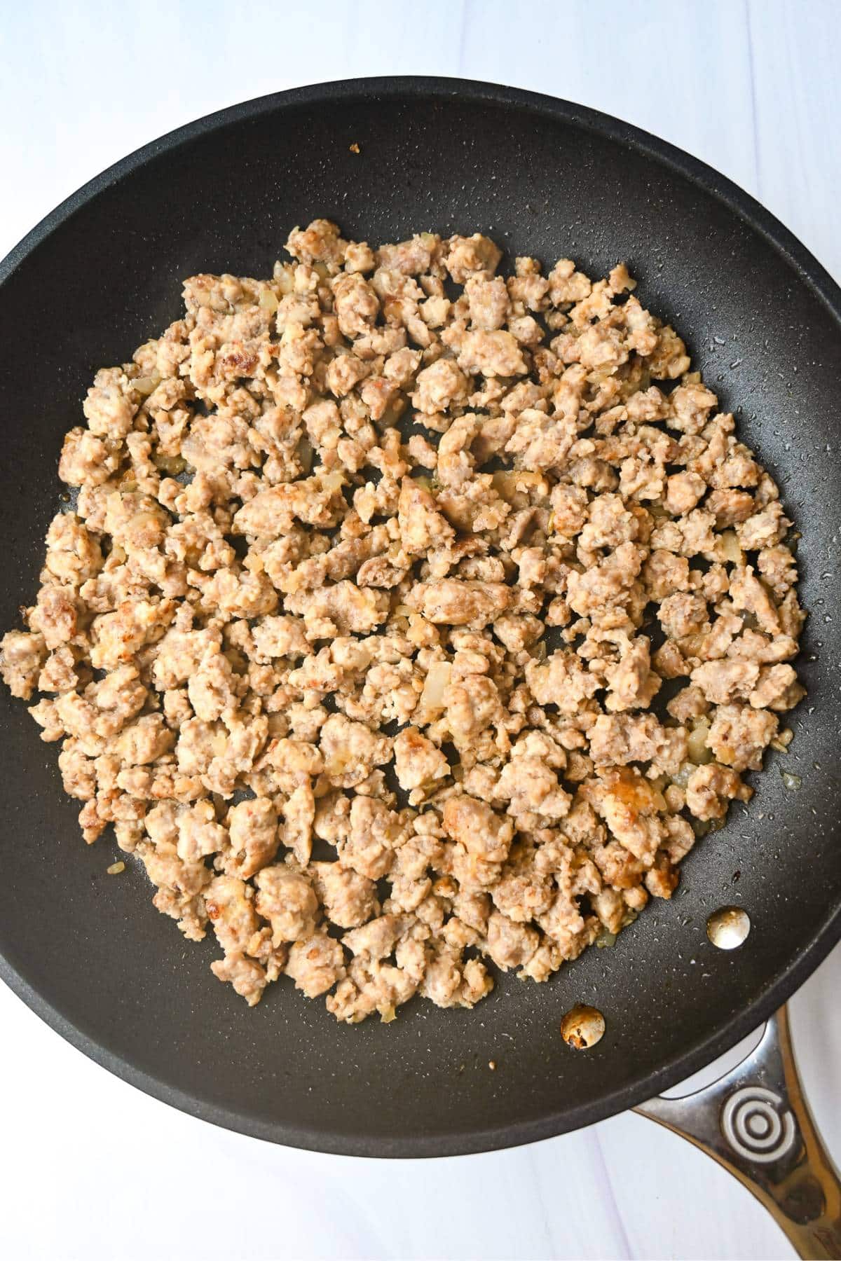 Italian sausage mixture cooked in a skillet