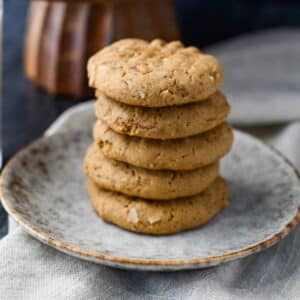 close up of a stack of cashew butter cookies on a plate