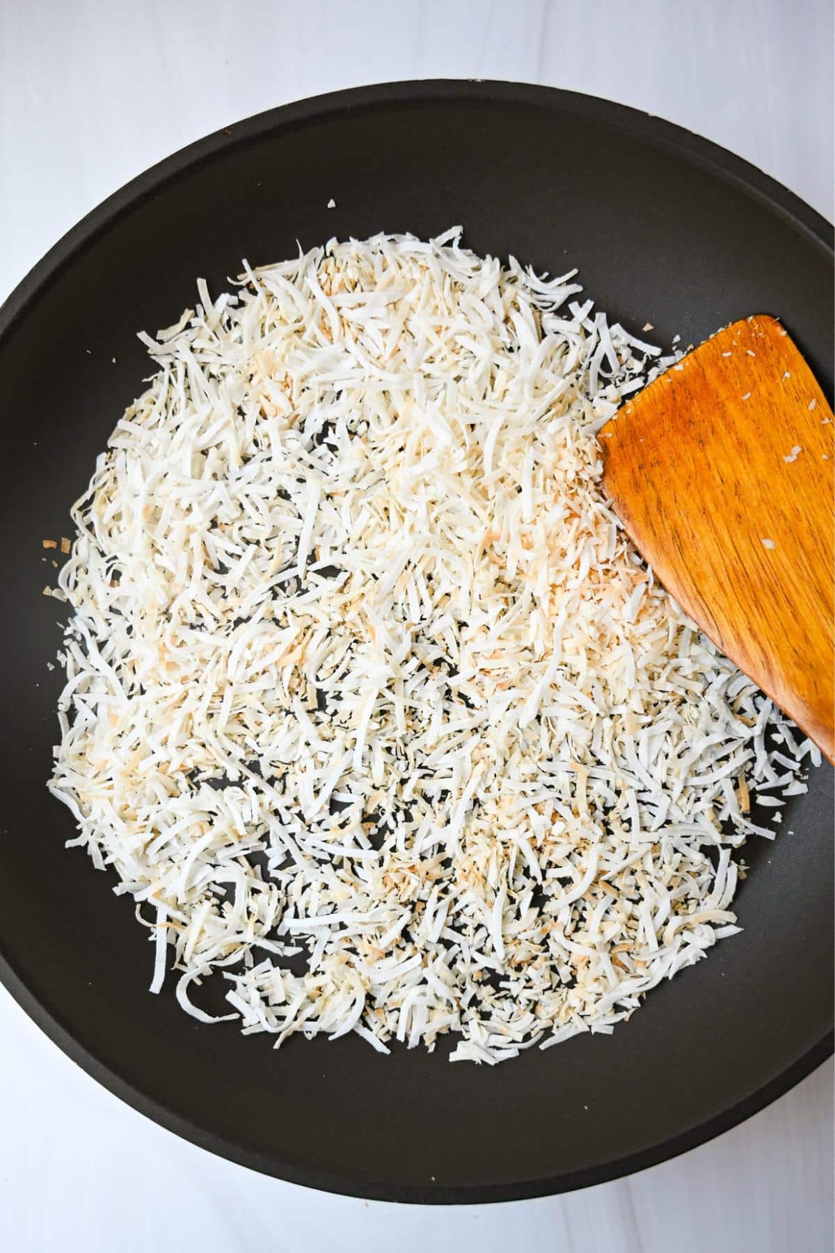 toasted unsweetened coconut in a skillet