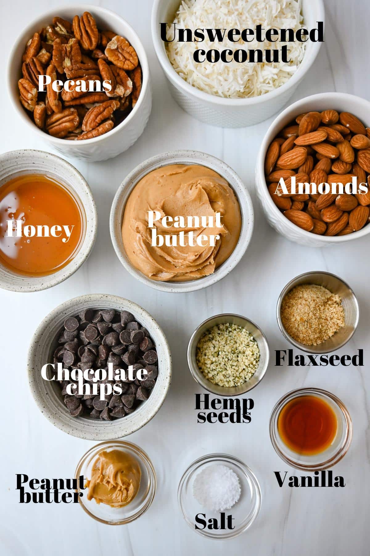 ingredients for making chocolate covered nutty bars measured out on a counter