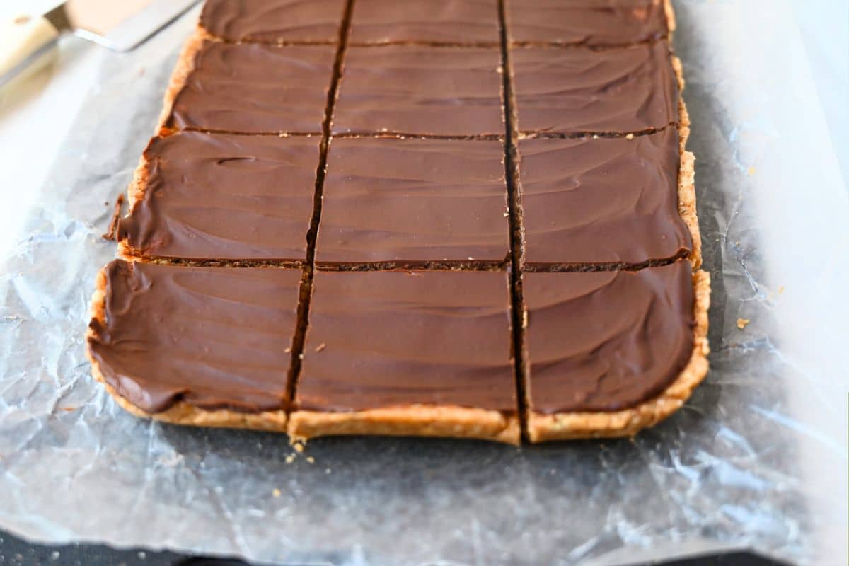 dessert bars sliced into squares on a cutting board