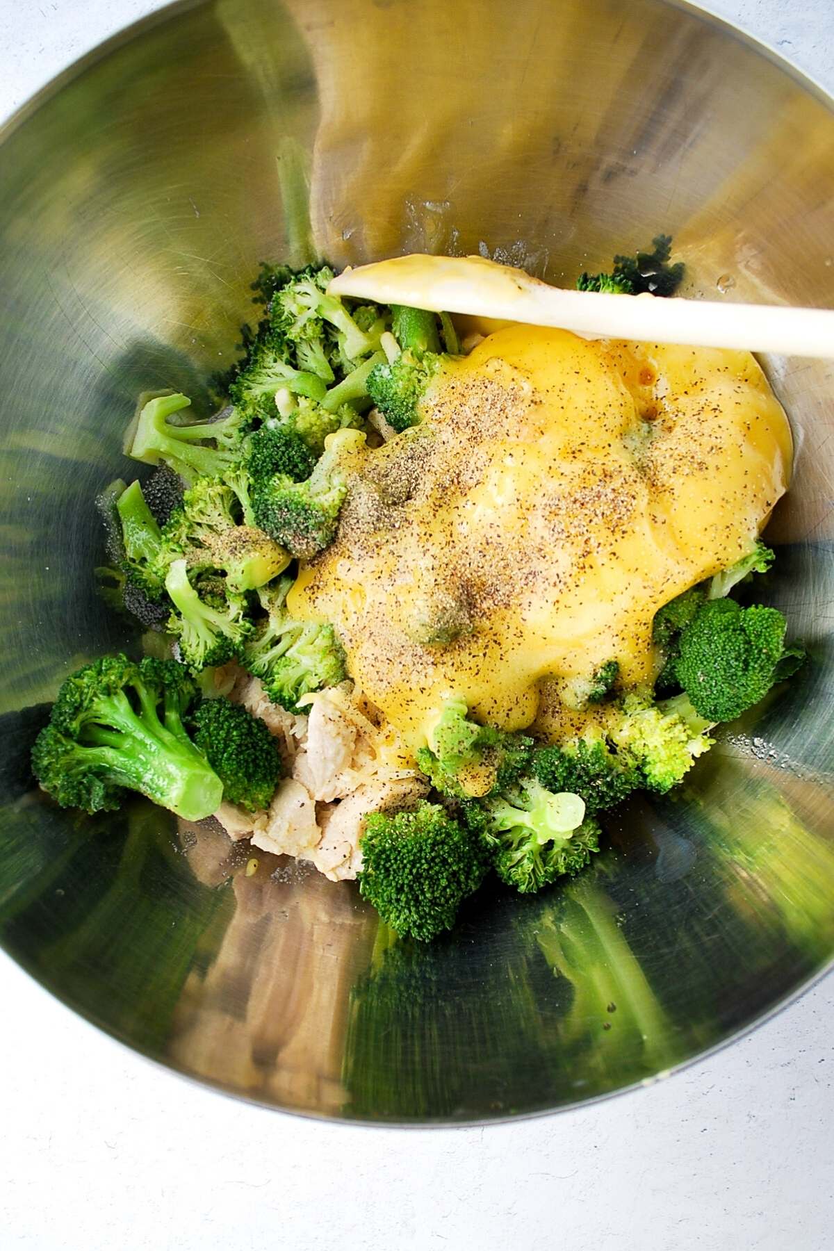 ingredients for chicken broccoli casserole in a mixing bowl